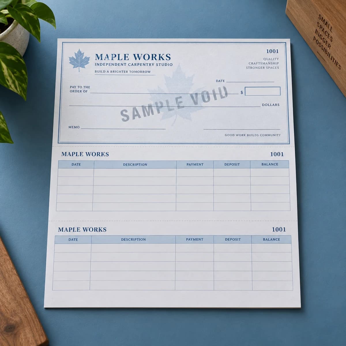 Laser business checks: MAPLE WORKS fictional independent carpentry studio, studio composition. Illustrative design concept.
